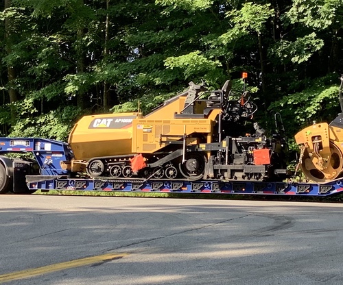 cat paver and roller on trailer