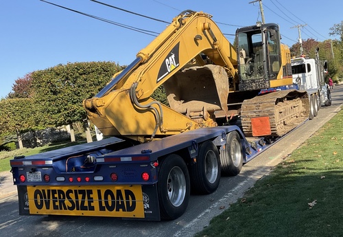 cat excavator on trailer